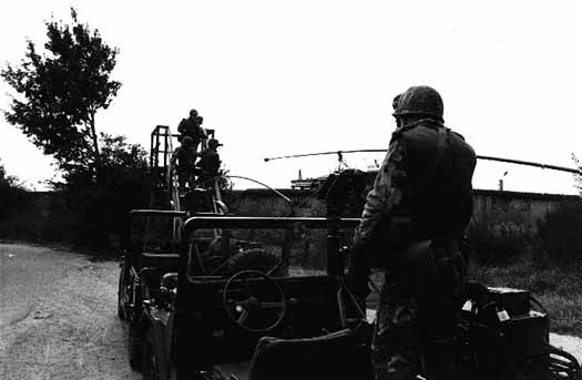 American soldiers patrol Berlin Wall